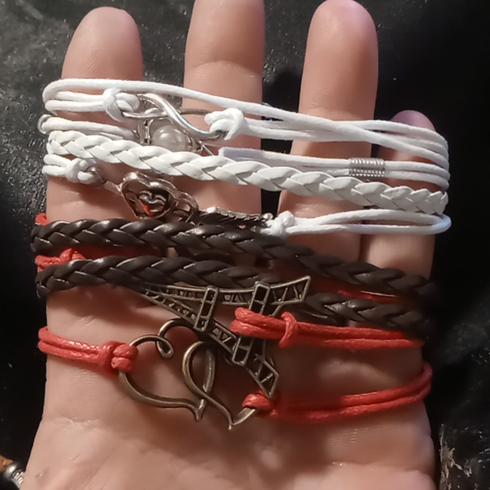 Leather braided layered charm bracelet. Red,brown,white. extendable